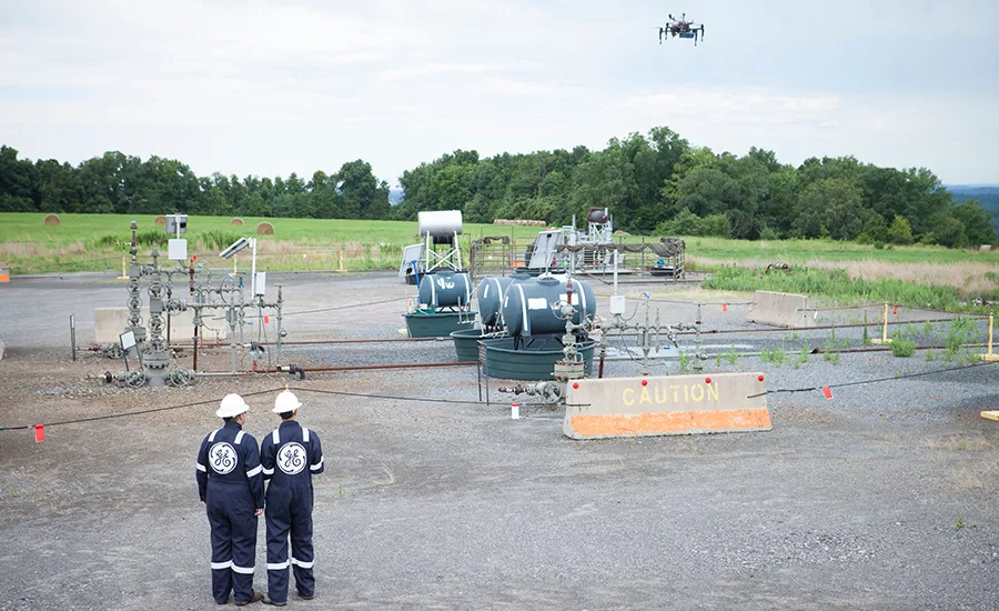 GE workers with drones