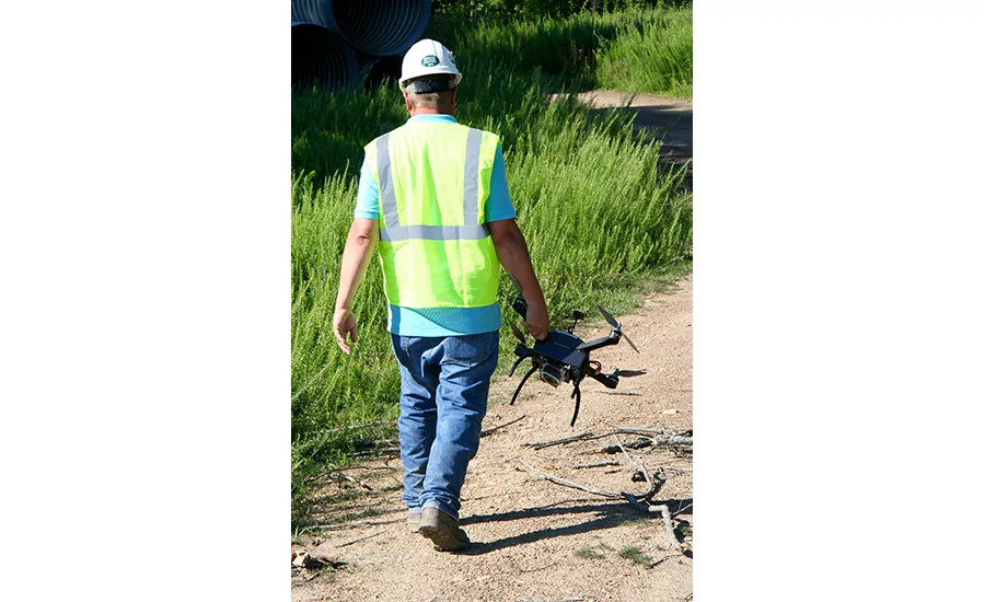 carrying drone into the field