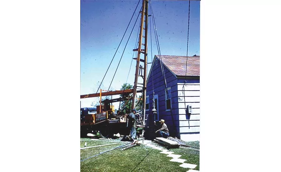 Schmitt's father and helper on a drilling job