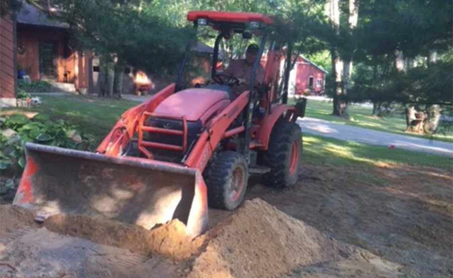 Bill Pearson driving tractor