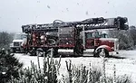 drilling rig on snowy jobsite