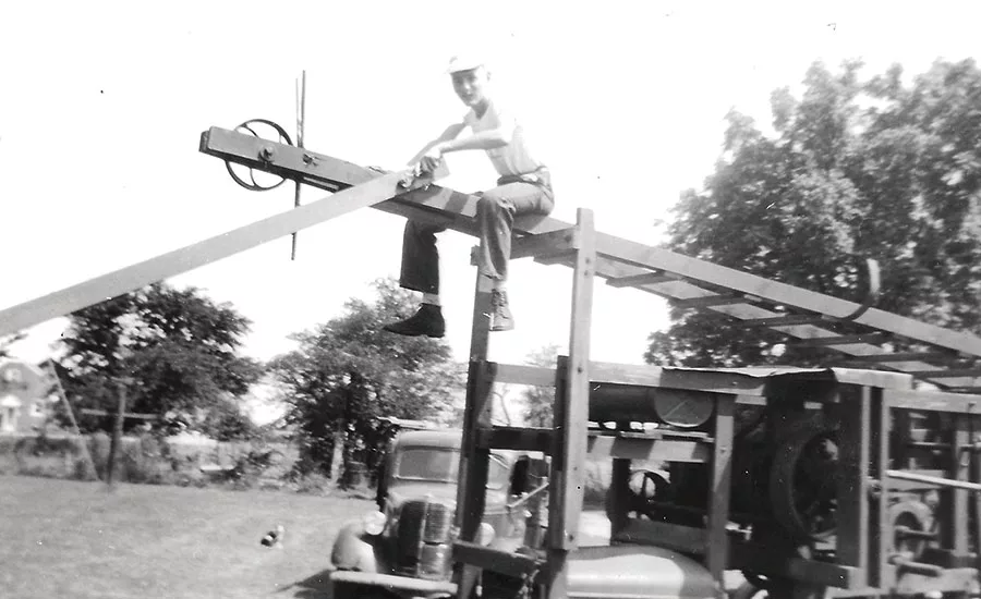 John Schmitt working on family's first drilling rig