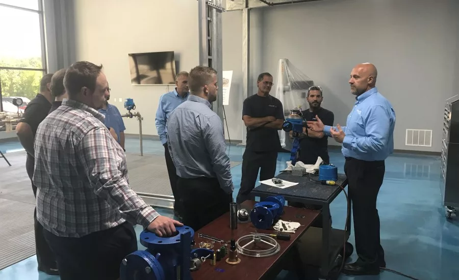 Tucci speaking to customers