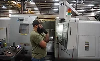 Brandon Lamar of Matrix Drilling Products operating CNC machine Brandon Lamar of Matrix Drilling Products operates one of the company’s CNC machines