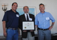 Rick Galletta, left, and John Capasso, right, receive the AGC award from Todd McDermott of AON Construction Services Group.  Source: MD Drilling