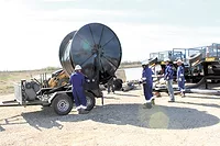 Hose Solutions has a "lay flat" approach to the problem of getting millions of gallons of fresh water quickly to a fracking site.