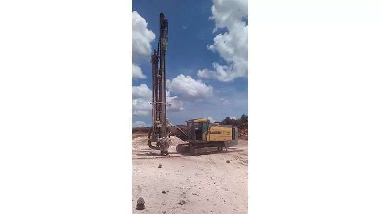 crew with Dangote Cement drills limestone